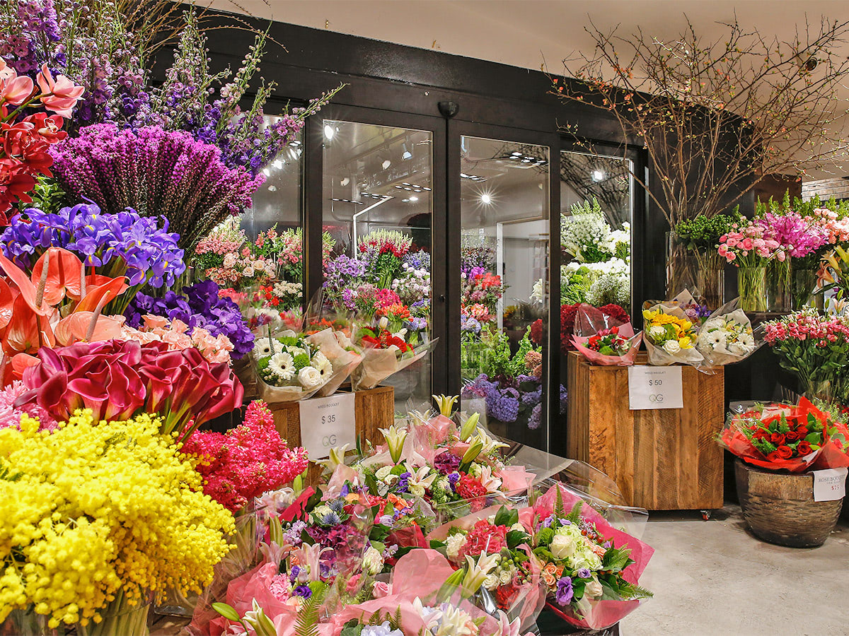 Fresh flowers and grab-n-go arrangements rest just outside our in-store flower fridge