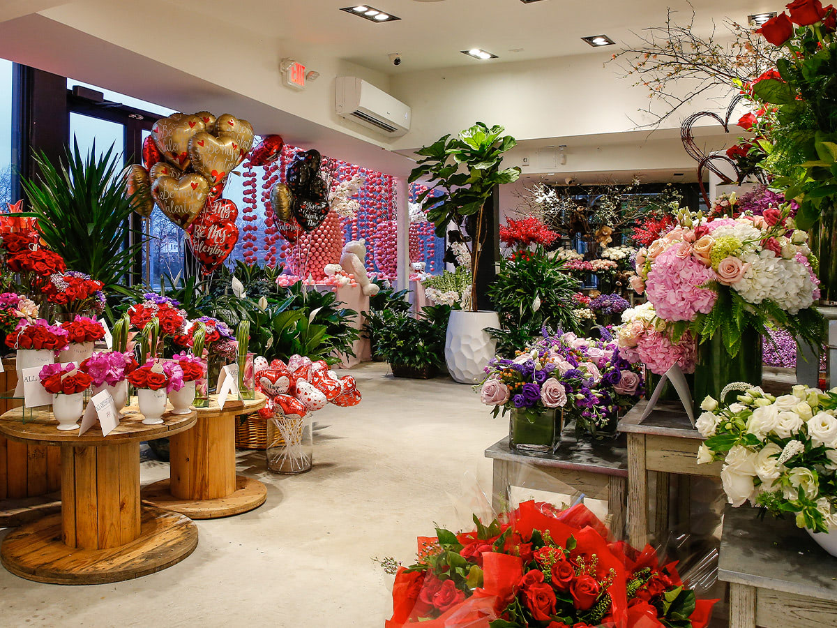 The front door of our Whitestone showroom is stocked with pink and red Valentine's Day arrangements